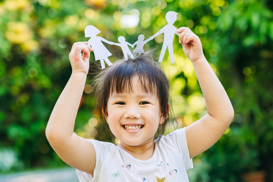 Portrait of Happy Kid with Family Cutout